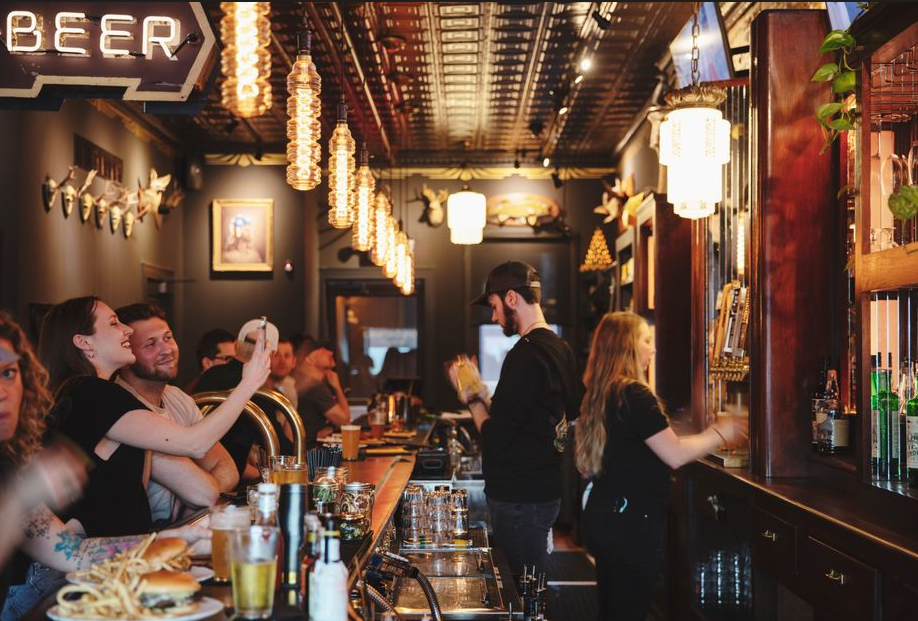 People enjoying a meal in a nice bar